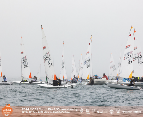 Youth racing dinghies on the ocean